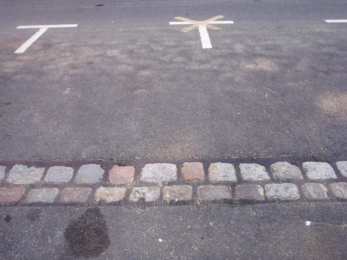this double line of bricks in the middle of the road is where the Berlin Wall stood.